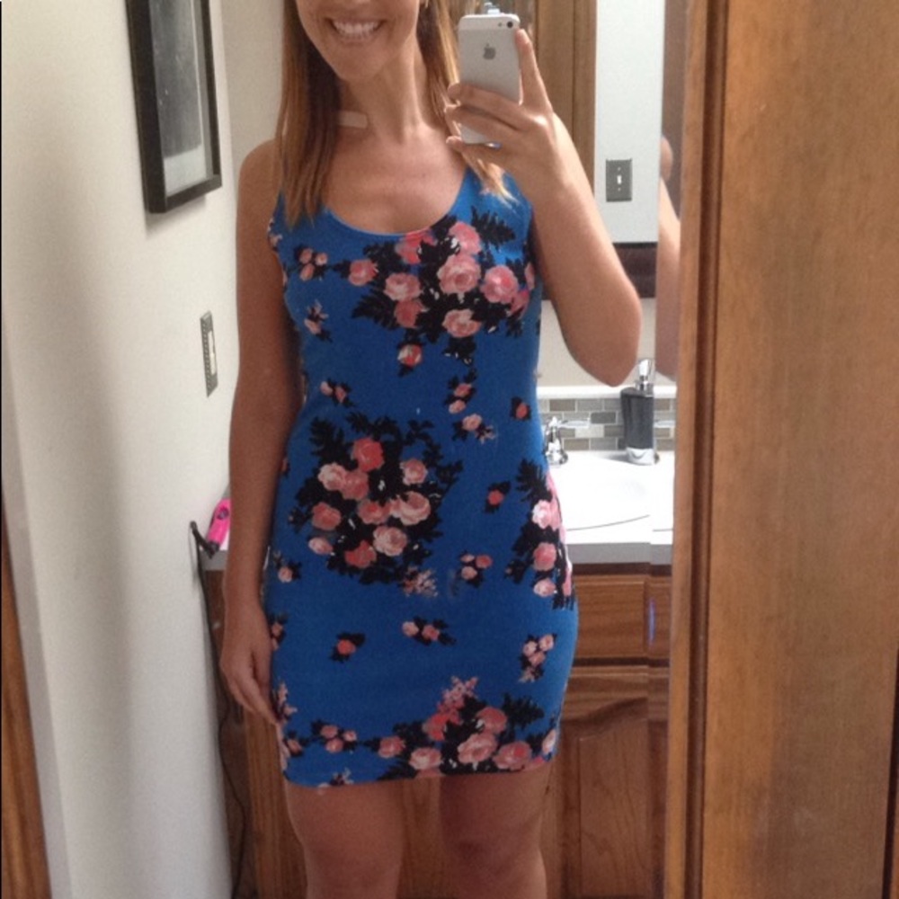 Beautiful blue dress with floral pattern and detail on back (see photo)